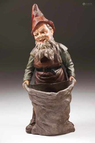 A garden gnome with a sackPolychrome terracotaAustria, 19th centuryHeight: 86 cm