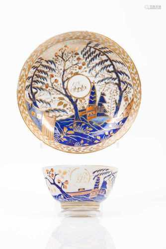 A cup and saucerChinese export porcelainRich polychrome decoration in shades of blue, salmon and