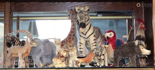 One shelf of mostly Steiff animals, including a zebra,