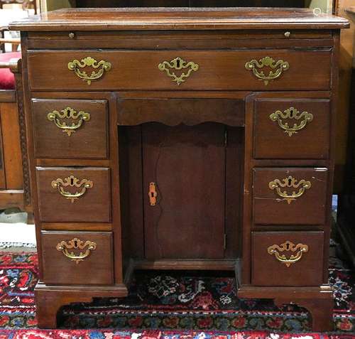 Federal style mahogany knee hole desk, the six drawers