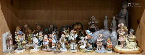 One shelf of mostly Hummel and Hummel style figures, in