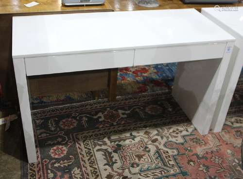 Modern white laquered work station, having two drawers