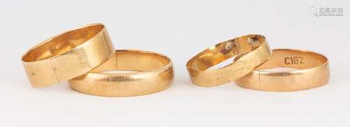 (Lot of 4) Yellow gold band rings