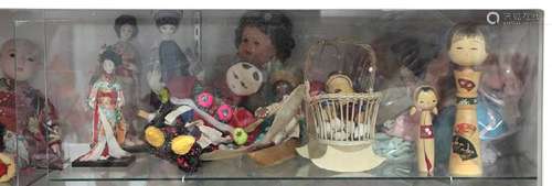 Two shelves of dolls