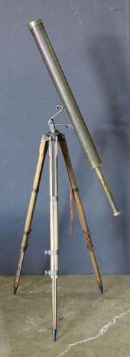 Brass terrestrial surveying telescope, rising on an