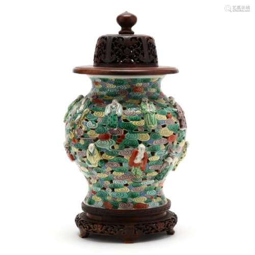 A Chinese Cloud and Immortal Jar with Wooden Cover and