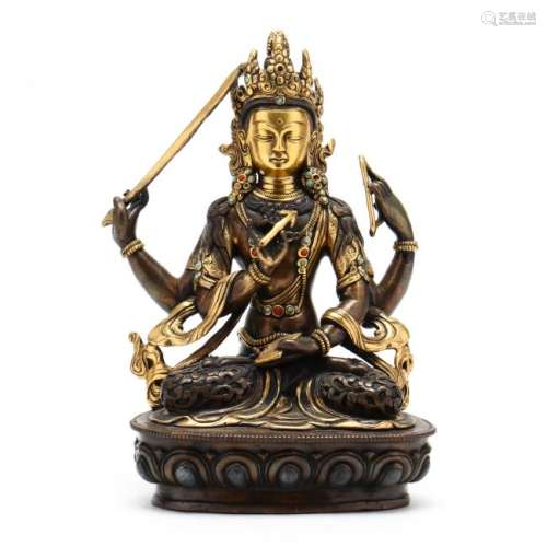 A Tibetan or Nepalese Four Armed Hindu Sculpture