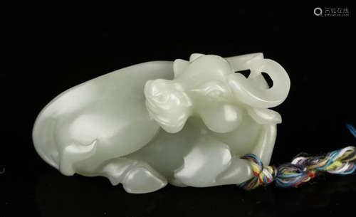 A HETIAN JADE FIGURE OF A COW ORNAMENT