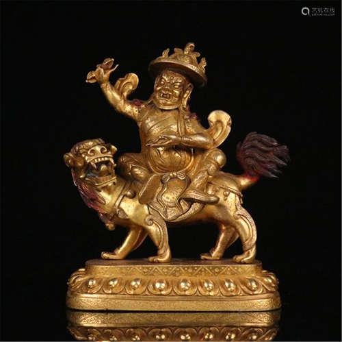 TIBETAN GILT BRONZE BUDDHIST GUARDIAN ON BEAST