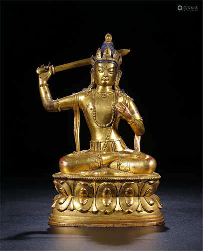 CHINESE GILT BRONZE SEATED BUDDHA WITH SWORD