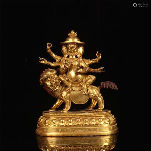 TIBETAN GILT BRONZE BUDDHIST GUARDIAN ON BEAST