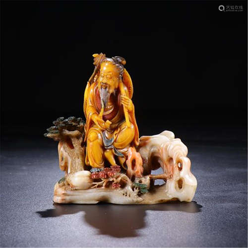 CHINESE SOAPSTONE SEATED FISHER ON ROCK