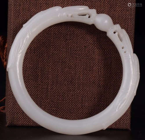 A HETIAN WHITE JADE CARVED DRAGON BANGLE