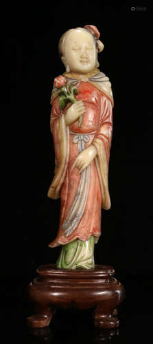 A SOAPSTONE CARVED FIGURE SHAPED STATUE