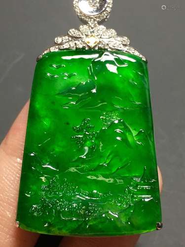 A GREEN JADEITE CARVED LANDSCAPE PENDANT, TYPE A