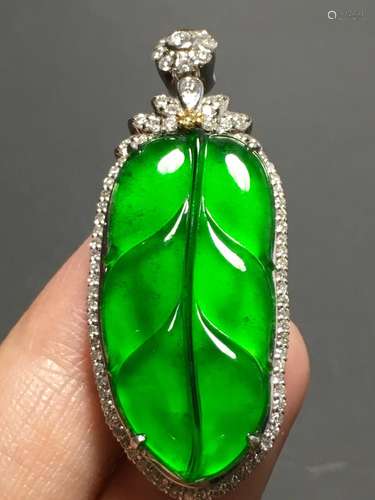 A GREEN JADEITE CARVED LEAF PENDANT, TYPE A