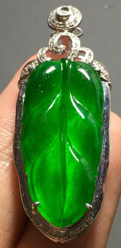 A GREEN JADEITE CARVED LEAF PENDANT, TYPE A