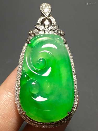 A GREEN JADEITE CARVED AUSPICIOUS PENDANT, TYPE A