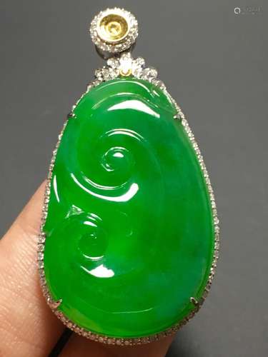 A GREEN JADEITE CARVED AUSPICIOUS PENDANT, TYPE A