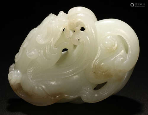 A HETIAN JADE CARVED BEAST SHAPED PENDANT