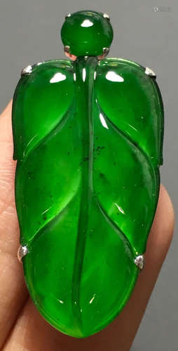 A GREEN JADEITE CARVED LEAF PENDANT, TYPE A