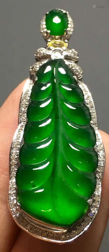 A GREEN JADEITE CARVED LEAF PENDANT, TYPE A