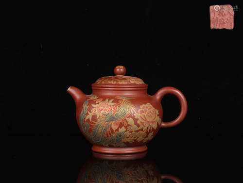 A QIANLONG MARK ZISHA TEAPOT OF PHEONIX PATTERN