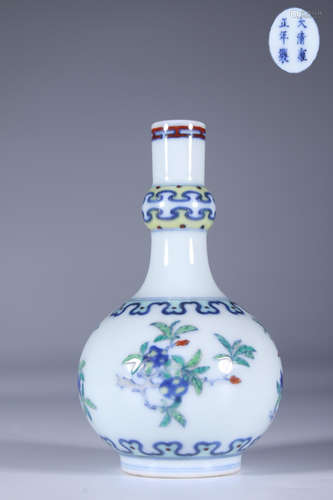 A DOU CAI GLAZED VASE CARVED IN BLOSSOMS