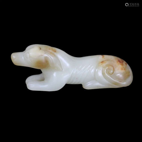 A JADE ORNAMENT WITH A DOG SHAPED