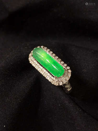 A GREEN JADEITE RING WRAPPED WITH DIAMONDS
