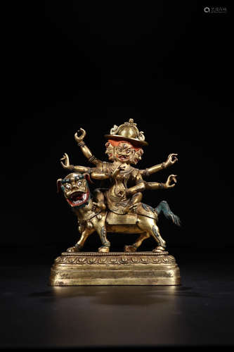 A COPPER GILT BUDDHA ORNAMENT