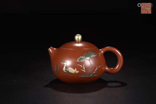 A ZISHA TEAPOT IN LOTUS SCENE