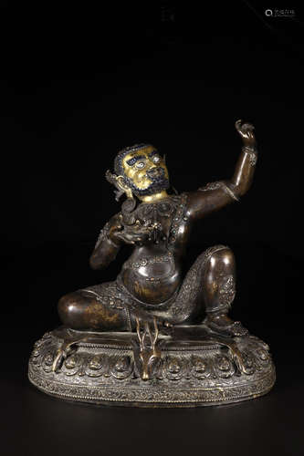 A COPPER GILT MAHASIDDHA BUDDHA STATUE