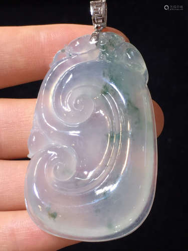 AN ICY JADEITE PENDANT CARVED IN RUYI SHAPED