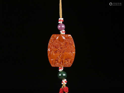 AN AMBER PENDANT CARVING LANDSCAPE