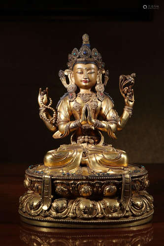 A GILT BRONZE GUANYIN SHAPED BUDDHA