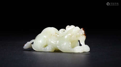 A HETIAN JADE CARVED 'QILINSONGZI' ORNAMENT