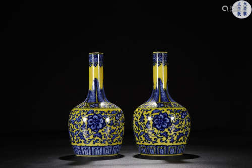 A PAIR OF 'YONGZHENG 'MARK YELLOW BACKGROUND WINDING LOTUS BLUE AND WHITE LONG NECK VASES