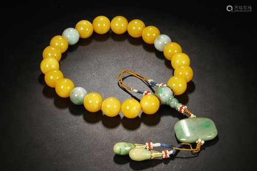 AN AMBER EIGHTEEN BEADS ROSARY