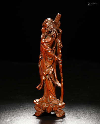 A HUANGYANG WOOD CARVED ARHAT FIGURE