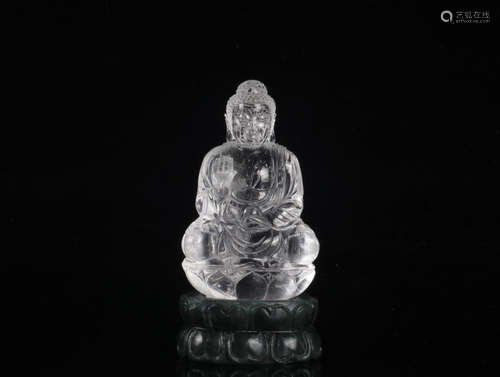 A CRYSTAL BUDDHA SHAPED ORNAMENT WITH JASPER BASE