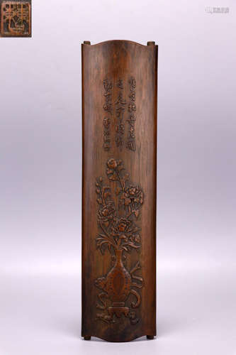 A BAMBOO ARM REST WITH FLORAL CARVING