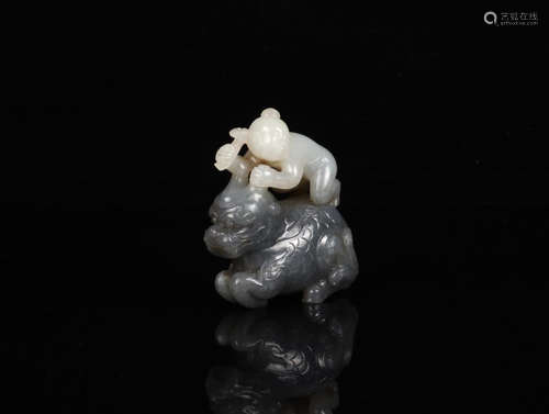 A HETIAN JADE ORNAMENT OF BEAST SHAPED