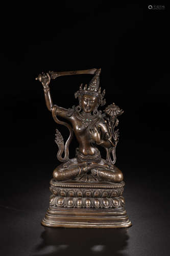 A COPPER INLAID TURQUOISE MANJUSRI BUDDHA STATUE