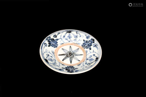 A BLUE AND WHITE PLATE WITH FLOWER PAINTED