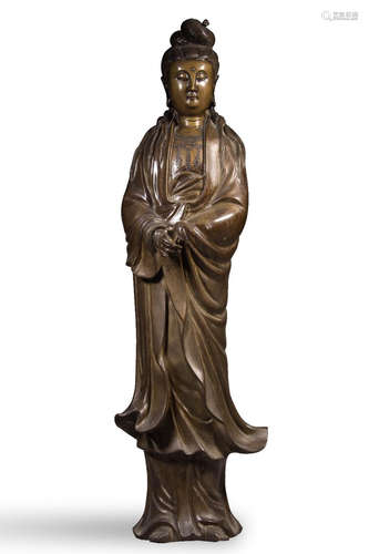 A COPPER GUANYIN SHAPED ORNAMENT