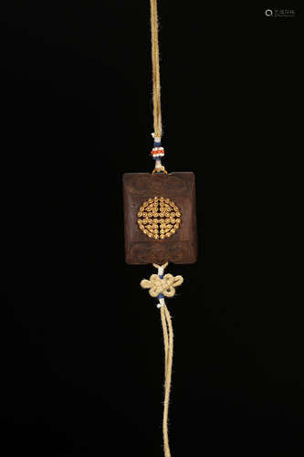 A CHENXIANG WOOD TABLET EMBEDED GOLD BEADS