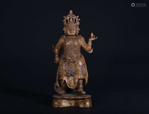 A GILT-BRONZE FIGURE OF VAISRVANA.MING PERIOD