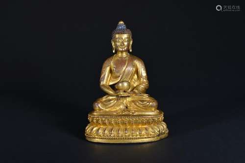 A GILT-BRONZE FIGURE OF SHAKYAMUNI.16TH CENTURY