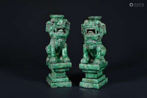 A PAIR OF GREEN-GLAZED 'LION' CANDEL STANDS.MING PERIOD
